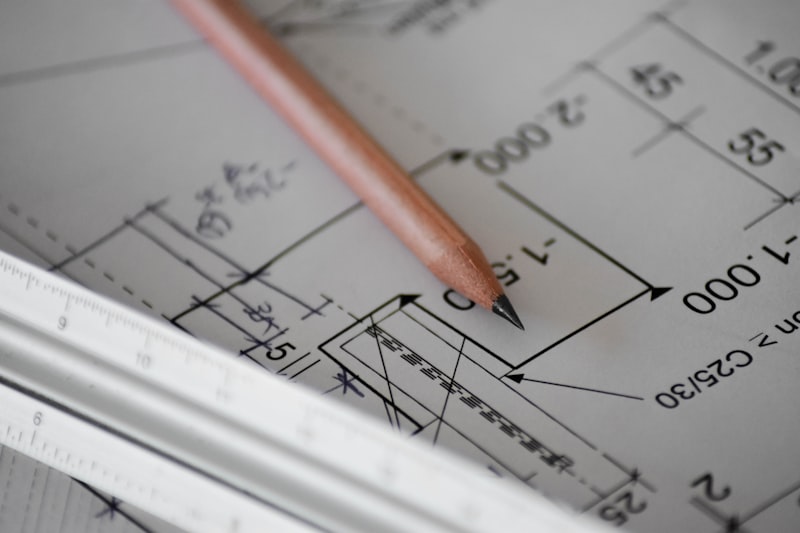 Pencil and ruler on engineering technical drawing